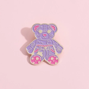 Cute purple enamel bear brooch pin with colorful patterns and gold outlines