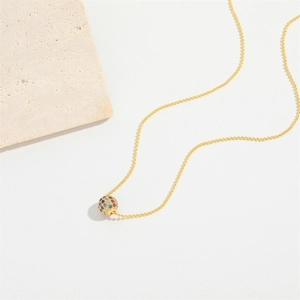 Elegant gold bead chain necklace featuring a colorful zircon pave ball pendant