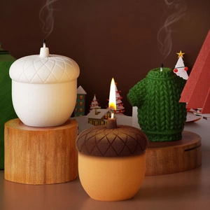 Cozy pinecone and sweater scented candles on wood stand for Christmas DIY gifts