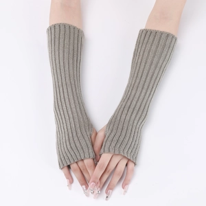 Close-up of grey ribbed knit long fingerless gloves showing arm warmers texture