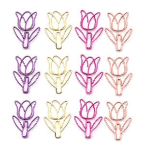 Flat lay of 12 tulip-shaped paper clips in purple, gold, and rose gold metallic finishes
