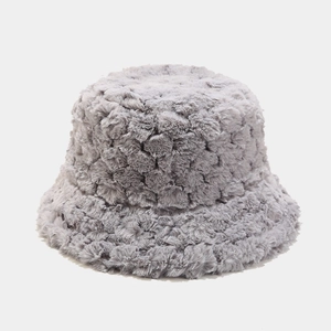 Detail shot of the thick grey faux fur texture on a warm winter bucket hat