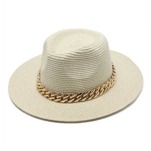 Classic beige straw Panama hat with a stylish chunky gold chain band for sun protection