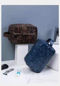 Macro detail of waterproof PU leather toiletry bag with premium vintage texture and handle