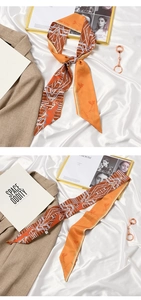 Detail of vintage French orange silk scarf with horse print and Love You lettering