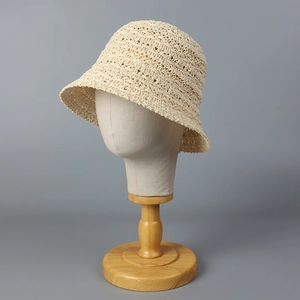 Breathable cream hollow crochet bucket hat for women on professional head display