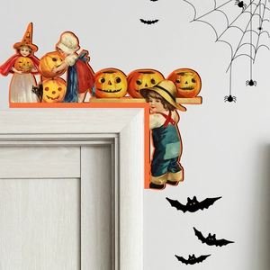 Detail of vintage Halloween wooden door corner decor with pumpkins and bat wall stickers