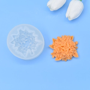 Detail of floral silicone mold showing intricate hydrangea textures and orange cast petals