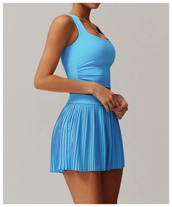 Detail of sky blue sports set with ruched cropped top and pleated tennis skirt for fitness