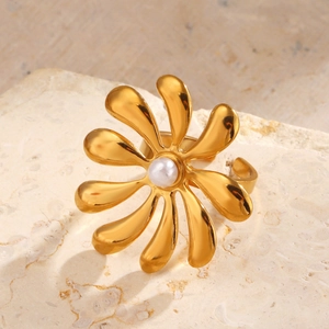 18K gold plated flower ring with pearl inlay on minimalist beige marble background