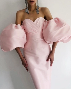 Detail view of pink off-shoulder satin dress featuring elegant oversized puff lantern sleeves