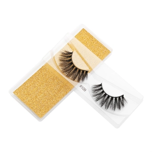 Detail of 3D faux mink eyelashes style #109 with dense black fibers in a gold glitter box