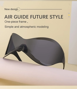 Minimalist black futuristic wrap-around sunglasses displayed on a pink podium