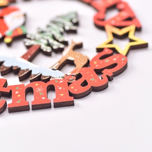 Hollow red wooden Christmas ornament featuring Santa, reindeer and tree elements