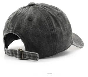 Detail of washed charcoal denim baseball cap showing rear metal buckle and fabric texture