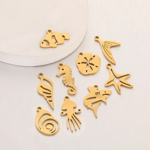 Golden ocean theme DIY charms set with seahorse starfish and shell shapes on white