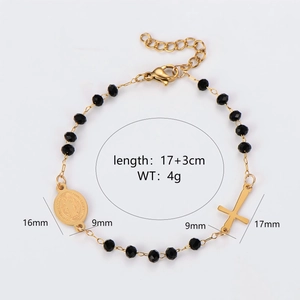 Gold stainless steel bracelet with black beads featuring saint medal and cross charms