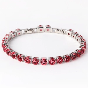 Detail of pink cubic zirconia tennis bracelet with silver claws and fold-over clasp