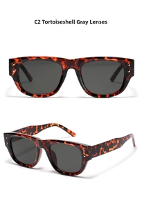 Detailed view of tortoiseshell square sunglasses with silver rivets and dark grey lenses