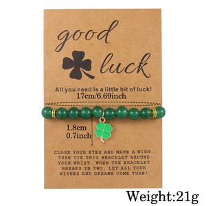 Saint Patricks Day green natural stone clover charm bracelet set on kraft card