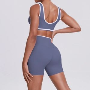 Detail of cross-back yoga bra and high-waisted shorts with white contrast trim