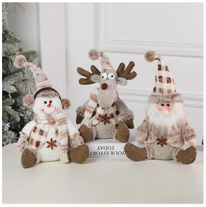 Charming trio of knit Christmas plush figures snowman and reindeer on white surface
