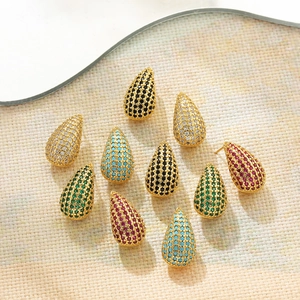 Micro shot of colorful teardrop pavé zircon stud earrings in various premium finishes