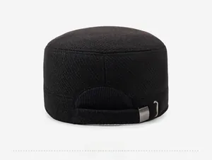 Rear view of black flat top cap showing thick twill fabric and adjustable metal buckle strap