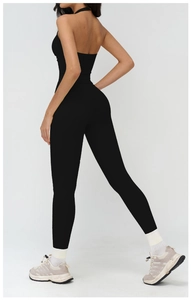 Detail view of the black halter backless yoga bodysuit with slimming fit for sports