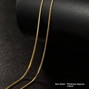 Detail of 1.0mm wide gold-toned stainless steel box chain necklace with high polish