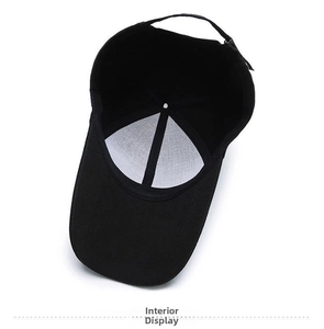 Detail view of the black cotton baseball cap interior featuring white lining and stitching