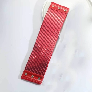 Detail of red pleated faux leather waist belt with silver metal snap button closure