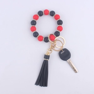 Silicone bead keychain bracelet with red and black beads, tassel, and gold hardware