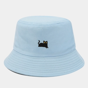 Close-up of small black cat embroidery on light blue twill cotton bucket hat detail