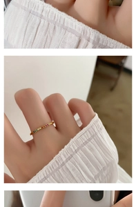 Macro view of gold plated titanium steel ring with colorful rainbow zirconia inlay