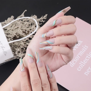 Long coffin press-on nails with mint green waves and gold lines on a nude base