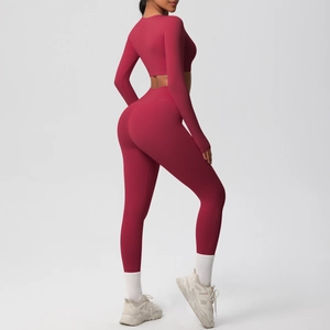 Rear view of sleek burgundy long sleeve yoga top and high waist leggings set