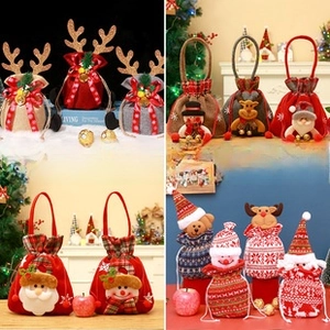 Detail of Christmas drawstring gift bags with plush Santa, reindeer, and snowman designs