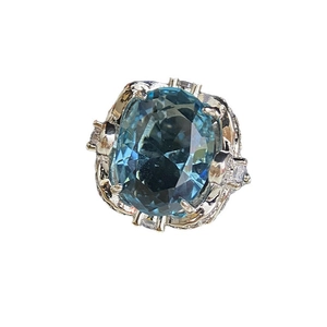 Luxury 18k gold plated silver ring with large oval blue gemstone and white side stones