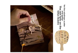 Detail of fan-shaped book lamp with bamboo pattern, jute rope wrap and Chinese aesthetic tag