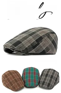 Detailed view of British plaid beret hats in gray, brown, and red knitted fabric textures