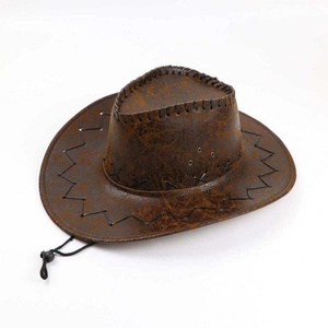 Detail of vintage brown cowboy hat with distressed texture and black cross-stitch edges
