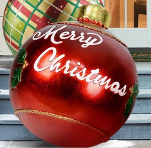 Close-up of 60cm red inflatable Christmas ball with white Merry Christmas lettering