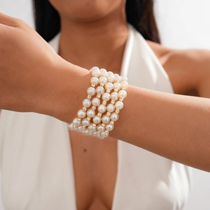 Detail of four-layer baroque pearl bracelet with sparkling rhinestone spacers on wrist