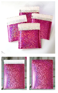 Detail of holographic rose red bubble mailer with adhesive seal and bubble cushioning