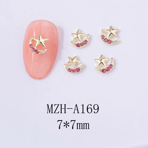 Macro detail of MZH-A169 star and moon nail charms with pink rhinestones for DIY nail art