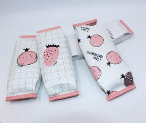 Detailed view of PU stationery bags with pomegranate and strawberry patterns and pink trim