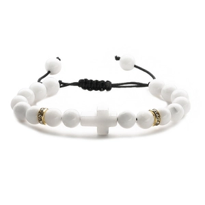 Detail of adjustable black woven cord on beaded white turquoise cross bracelet
