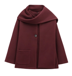 Detail of burgundy wool-blend short coat featuring a built-in scarf collar and large pocket