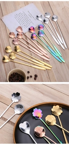 Detail view of flower and heart shaped long handle stainless steel spoons in various finishes